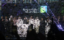Saudi Arabia's state-owned oil company Saudi Armco and stock market officials celebrate during the official ceremony marking the debut of Aramco's initial public offering (IPO) on the Riyadh's stock market in Riyadh, Saudi Arabia, Wednesday, Dec. 11, 2019. (AP Photo/Amr Nabil)