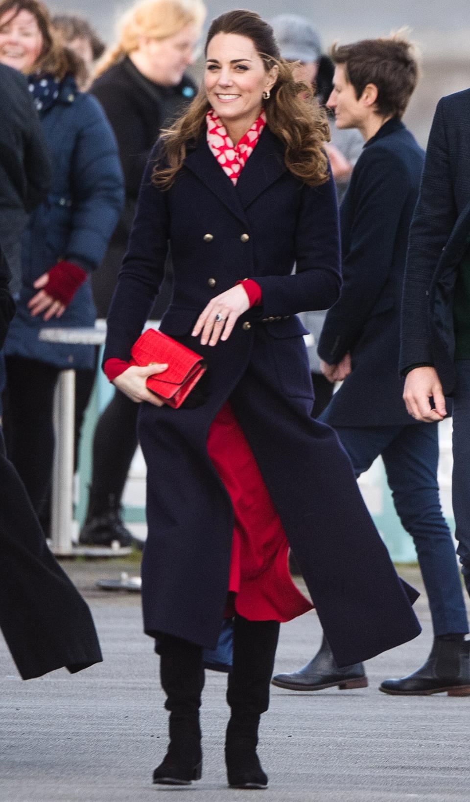 Kate Middleton and Prince William <a href="https://people.com/royals/kate-middleton-and-prince-william-head-out-for-ice-cream-during-visit-to-south-wales-seaside/" rel="nofollow noopener" target="_blank" data-ylk="slk:visited the South Wales resort of Mumbles;elm:context_link;itc:0;sec:content-canvas" class="link ">visited the South Wales resort of Mumbles</a> to meet rescue crews and volunteers at the local lifeboat station, even stopping for a bite of ice cream. Kate opted for a navy coat by Hobbs with a red-and-white scarf over a red Zara midi dress and black boots. <strong>Get the Look!</strong> Milumia Elegant Frilled Long Sleeve Pleated Fit & Flare Dress, $32.99–$36.99; <a href="https://www.amazon.com/Milumia-Womens-Elegant-Frilled-Pleated/dp/B078H2ZHNY/ref=as_li_ss_tl?ie=UTF8&linkCode=ll1&tag=poamzfkatemiddletonwinterstylekphillips0220-20&linkId=b1edb77d13dd18e56cd8ad4592b62956&language=en_US" rel="nofollow noopener" target="_blank" data-ylk="slk:amazon.com;elm:context_link;itc:0;sec:content-canvas" class="link ">amazon.com</a> Floerns High Neck Plaid Fit & Flare Midi Dress, $28.99–$34.99; <a href="https://www.amazon.com/Floerns-Womens-High-Flare-Dress/dp/B07JFRGSGT/ref=as_li_ss_tl?ie=UTF8&linkCode=ll1&tag=poamzfkatemiddletonwinterstylekphillips0220-20&linkId=c2d999c390eedafeed43a379ad63fbe7&language=en_US" rel="nofollow noopener" target="_blank" data-ylk="slk:amazon.com;elm:context_link;itc:0;sec:content-canvas" class="link ">amazon.com</a> Warehouse Tiered Lapel Midi Dress, $83; <a href="https://click.linksynergy.com/deeplink?id=93xLBvPhAeE&mid=35719&murl=https%3A%2F%2Fwww.asos.com%2Fus%2Fwarehouse%2Fwarehouse-tiered-lapel-midi-dress%2Fprd%2F14070658&u1=PEO%2CShopping%3AEverythingYouNeedtoCopyKateMiddleton%E2%80%99sChicWinterStyle%2Ckamiphillips2%2CUnc%2CGal%2C7360903%2C202002%2CI" rel="nofollow noopener" target="_blank" data-ylk="slk:asos.com;elm:context_link;itc:0;sec:content-canvas" class="link ">asos.com</a> Vince Camuto Long Sleeve Sweater Dress, $148; <a href="https://click.linksynergy.com/deeplink?id=93xLBvPhAeE&mid=1237&murl=https%3A%2F%2Fshop.nordstrom.com%2Fs%2Fvince-camuto-long-sleeve-sweater-dress%2F5406247%2Ffull&u1=PEO%2CShopping%3AEverythingYouNeedtoCopyKateMiddleton%E2%80%99sChicWinterStyle%2Ckamiphillips2%2CUnc%2CGal%2C7360903%2C202002%2CI" rel="nofollow noopener" target="_blank" data-ylk="slk:nordstrom.com;elm:context_link;itc:0;sec:content-canvas" class="link ">nordstrom.com</a> Nake Wardrobe The NW Long-Sleeve Dress, $54; <a href="https://click.linksynergy.com/deeplink?id=93xLBvPhAeE&mid=13867&murl=https%3A%2F%2Fwww.bloomingdales.com%2Fshop%2Fproduct%2Fnaked-wardrobe-the-nw-long-sleeve-dress%3FID%3D3608189&u1=PEO%2CShopping%3AEverythingYouNeedtoCopyKateMiddleton%E2%80%99sChicWinterStyle%2Ckamiphillips2%2CUnc%2CGal%2C7360903%2C202002%2CI" rel="nofollow noopener" target="_blank" data-ylk="slk:bloomingdales.com;elm:context_link;itc:0;sec:content-canvas" class="link ">bloomingdales.com</a> Tahari Crepe Sheath Dress, $138; <a href="https://click.linksynergy.com/deeplink?id=93xLBvPhAeE&mid=1237&murl=https%3A%2F%2Fshop.nordstrom.com%2Fs%2Ftahari-crepe-sheath-dress%2F5382787%2Ffull&u1=PEO%2CShopping%3AEverythingYouNeedtoCopyKateMiddleton%E2%80%99sChicWinterStyle%2Ckamiphillips2%2CUnc%2CGal%2C7360903%2C202002%2CI" rel="nofollow noopener" target="_blank" data-ylk="slk:nordstrom.com;elm:context_link;itc:0;sec:content-canvas" class="link ">nordstrom.com</a>