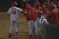 Los Angeles Angels' Jason Castro, left, is congratulated by manager Joe Maddon after hitting a solo home run against the Oakland Athletics during the ninth inning of a baseball game in Oakland, Calif., Friday, July 24, 2020. (AP Photo/Jeff Chiu)