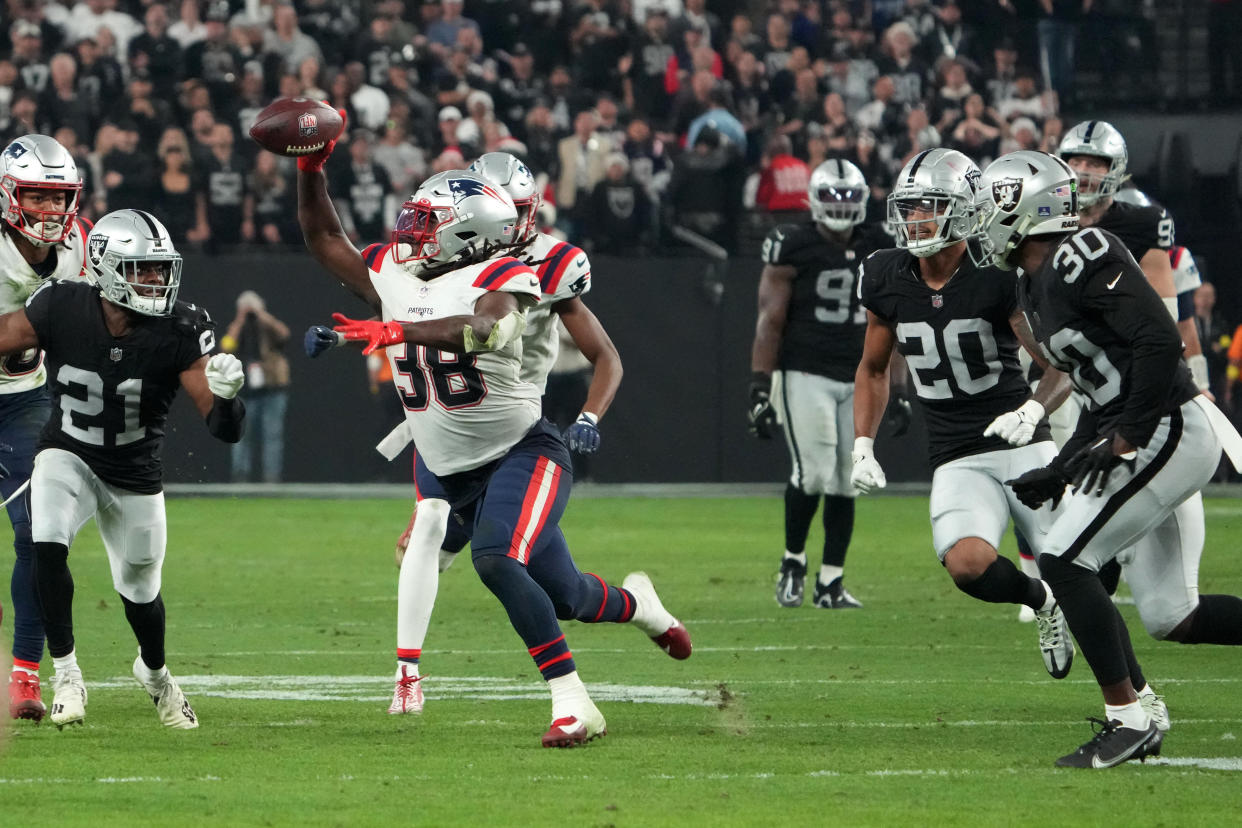 Dec 18, 2022; Paradise, Nevada, USA; New England Patriots running back Rhamondre Stevenson (38) throws a lateral in the fourth quarter against the Las Vegas Raiders at Allegiant Stadium. The Raiders defeated the Patriots 30-24. Mandatory Credit: Kirby Lee-USA TODAY Sports