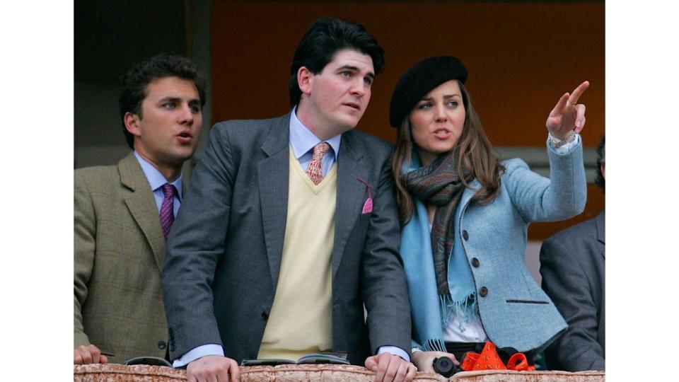 Thomas van Straubenzee (left) and Kate Middleton (right) watch the Gold Cup horse race from the balcony of the Royal Box as she attends the Cheltenham Horse Racing Festival on March 16, 2007