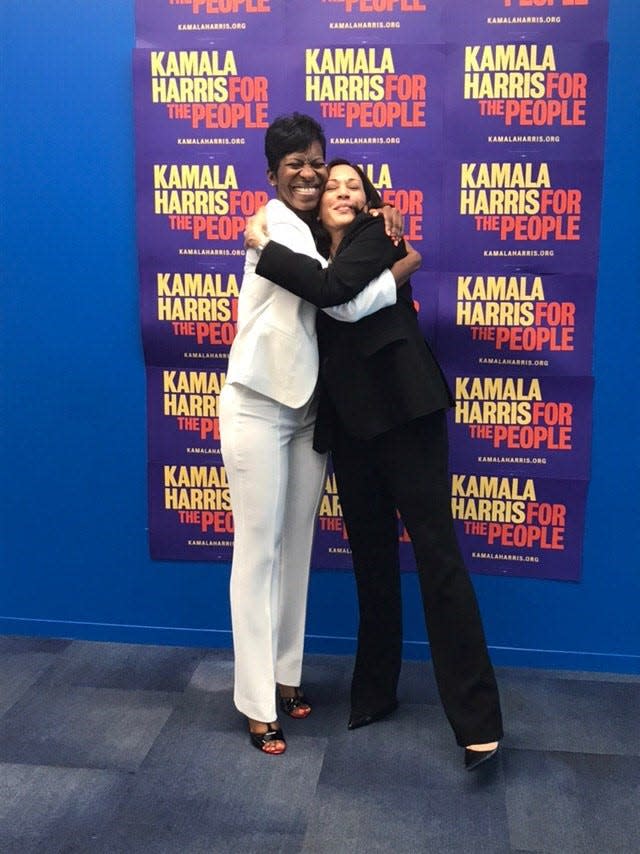 Kamala Harris hugs her line sister Lorri Saddler Rice at a fundraiser event.