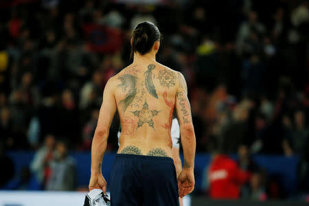 Paris St Germain's Zlatan Ibrahimovic walks out of the pitch at the end of the French Ligue 1 soccer match against En Avant Guingamp at Parc des Princes stadium in Paris, France May 8, 2015. REUTERS/Gonzalo Fuentes/File Photo