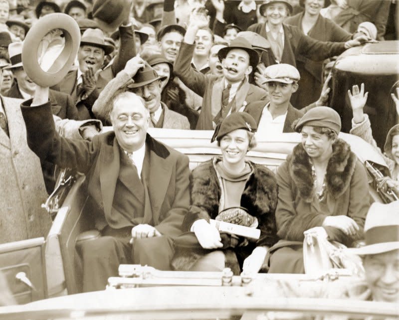 New York Gov. Franklin Delano Roosevelt rides in the back of an open-top car with his daughter Anna Roosevelt Halsted and wife Eleanor while campaigning in Warm Springs, Ga., on October 24, 1932. On November 8, 1932, voters elected Roosevelt as the 32nd president of the United States, defeating incumbent President Herbert Hoover. File Photo courtesy FDR Presidential Library