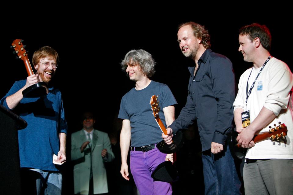 In this May 7, 2008 file photo, members of the band Phish, from left, Trey Anastasio, Mike Gordon, Page McConnell and Jon Fishman are honored at the seventh annual Jammy awards at the Theater at Madison Square Garden in New York. (AP Photo/Jason DeCrow, file)