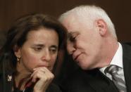 Federal Reserve Board Governor Tarullo confers with Miller, Federal Reserve Undersecretary for Domestic Finance, before Senate Banking, Housing and Urban Affairs Committee in Washington