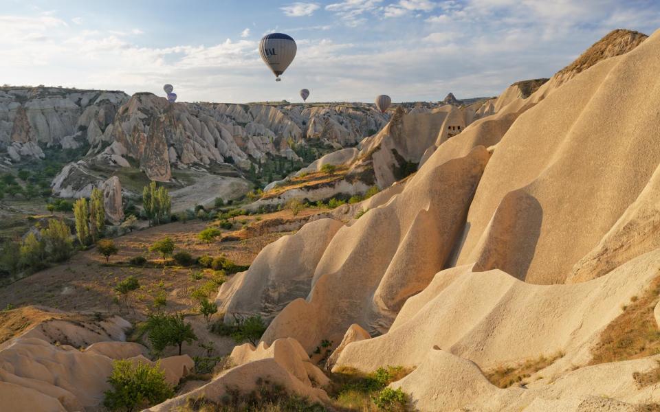 <p>Cappadocia is the “<a rel="nofollow noopener" href="http://www.goreme.com/horseback-riding-tours.php" target="_blank" data-ylk="slk:Land of Beautiful Horses;elm:context_link;itc:0;sec:content-canvas" class="link ">Land of Beautiful Horses</a>,” so you should explore the <a rel="nofollow noopener" href="https://www.tripadvisor.com/Attractions-g297980-Activities-c61-t62-Cappadocia.html" target="_blank" data-ylk="slk:landscape by horse;elm:context_link;itc:0;sec:content-canvas" class="link ">landscape by horse</a> as well as by hot air balloon. While you’re on the ground, don’t forget to indulge in <a rel="nofollow noopener" href="http://www.timeout.com/travel/features/693/winemaking-in-cappadocia" target="_blank" data-ylk="slk:wine tasting;elm:context_link;itc:0;sec:content-canvas" class="link ">wine tasting</a>.</p>