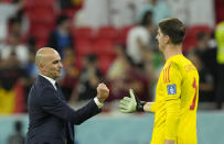 Belgium's head coach Roberto Martinez, left, shakes hands with Belgium's goalkeeper Thibaut Courtois after the World Cup group F soccer match between Croatia and Belgium at the Ahmad Bin Ali Stadium in Al Rayyan, Qatar, Thursday, Dec. 1, 2022. (AP Photo/Francisco Seco)