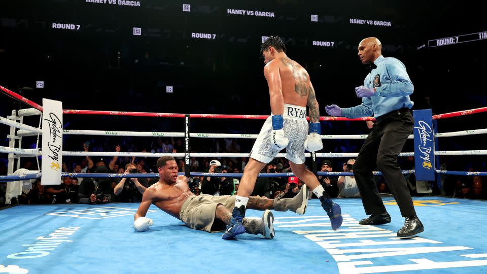 Ryan Garcia knocks down Devin Haney during their WBC super lightweight title bout at Barclays Center on April 20, 2024 in New York City. - Al Bello/Getty Images