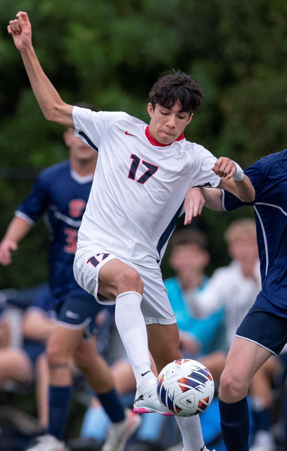 Benjamin's Cian Hoban and Oxbridge Academy Chris Cano compete for the ball during their playoff soccer game on February 9, 2024, in Palm Beach Gardens, Florida.