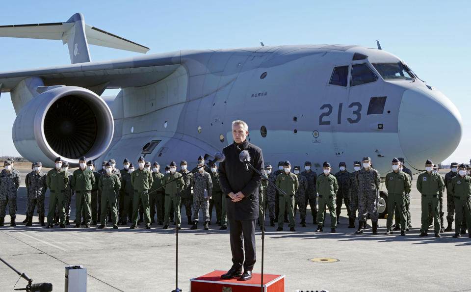 NATO Secretary General Jens Stoltenberg delivers a speech as he visits Japan Air Self-Defence Force base.