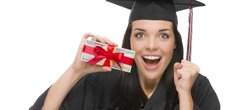 Female college graduate holding money tied with bow.