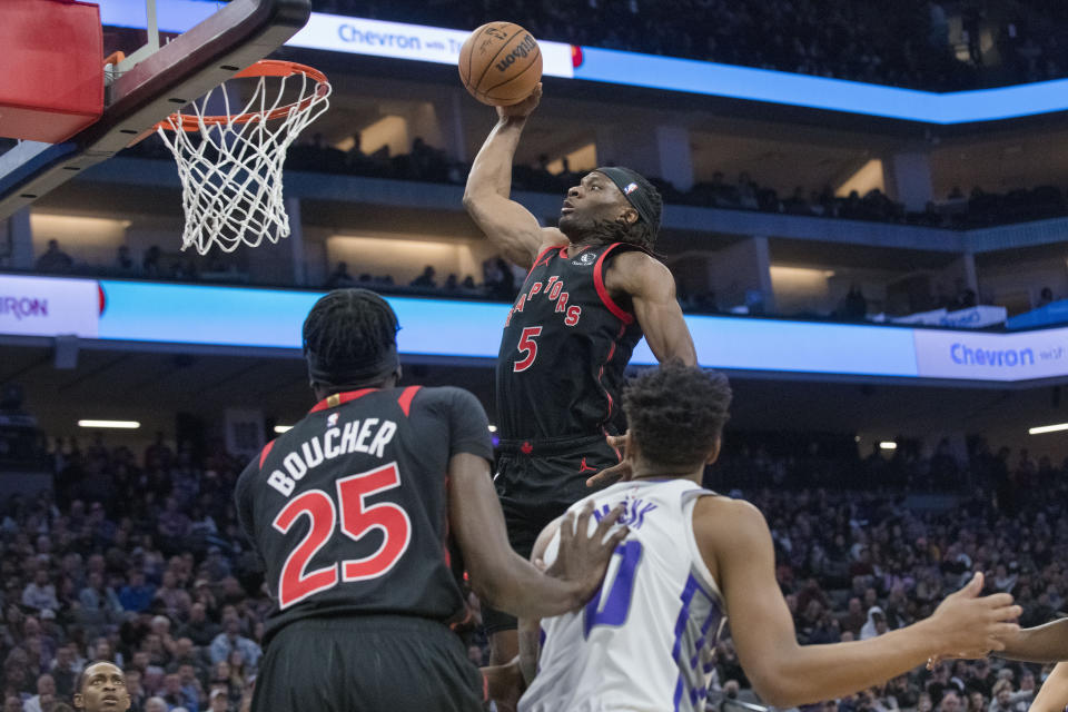 Toronto Raptors forward Precious Achiuwa (5) dunks the ball against the Sacramento Kings during the first quarter of an NBA basketball game in Sacramento, Calif., Wednesday, Jan. 25, 2023. (AP Photo/Randall Benton)