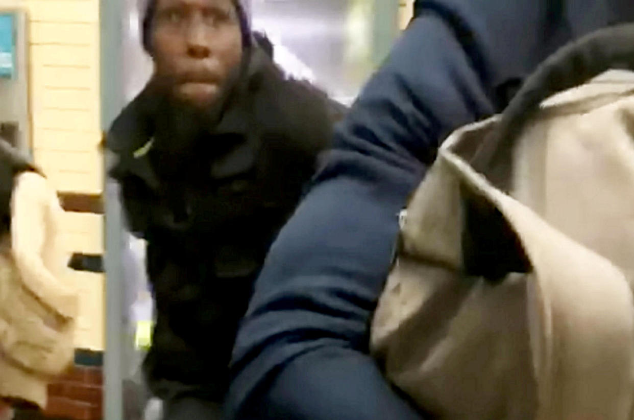 Detectives have issued an image of a suspect in their investigation into a man who pushed a commuter on to the tracks at a Tube station and attacked two others. (SWNS)