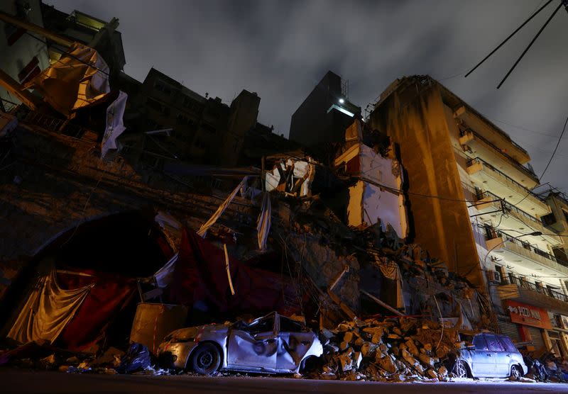 A view shows damage to building and cars in the aftermath of a massive explosion at the port of Beirut