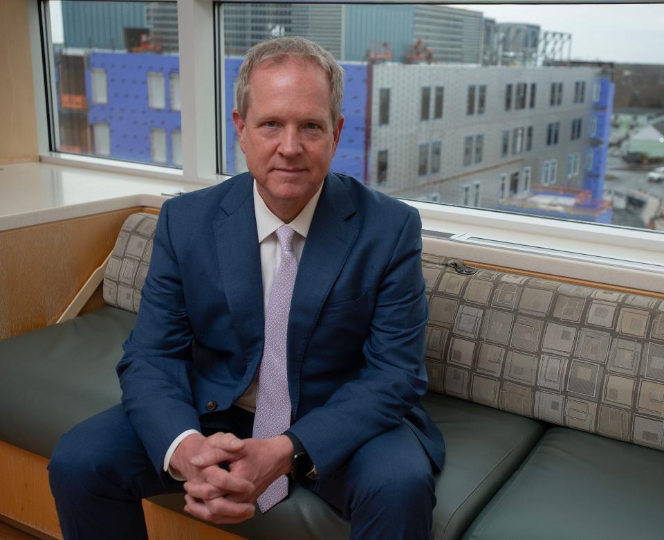 "It will be one-stop shopping for cancer treatment," Cape Cod Healthcare President and CEO Mike Lauf said Thursday of services planned for the new Peter and Pamela Barbey Patient Care Tower at Cape Cod Hospital in Hyannis. The tower rises behind Lauf in a photo from Wednesday.