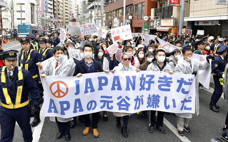 Chinese residents in Japan march at a protest against the Japanese hotel chain APA in Tokyo, Japan in this photo taken by Kyodo February 5, 2017. Mandatory credit Kyodo/via REUTERS