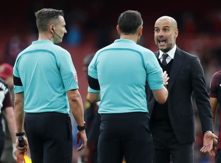 Britain Football Soccer - Arsenal v Manchester City - Premier League - Emirates Stadium - 2/4/17 Manchester City manager Pep Guardiola speaks to referee Andre Marriner at full time Reuters / Eddie Keogh Livepic