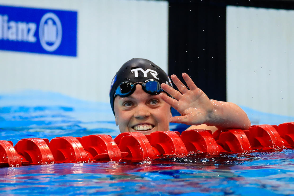 Ellie Simmonds waves to the crowd at the London Aquatics Centre after winning bronze in the 100m breaststroke on the final night of racing