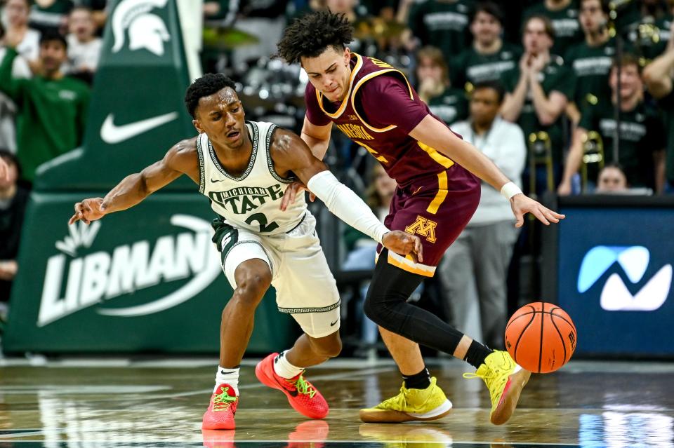 Michigan State's Tyson Walker, left, pressures Minnesota's Mike Mitchell Jr. during the second half on Thursday, Jan. 18, 2024, at the Breslin Center in East Lansing.