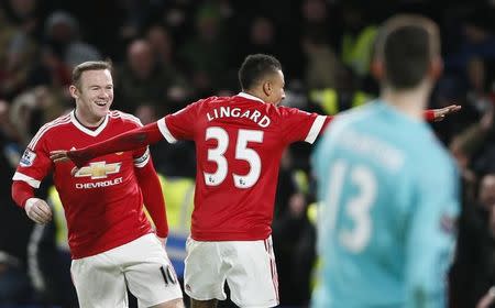 Football Soccer - Chelsea v Manchester United - Barclays Premier League - Stamford Bridge - 7/2/16 Manchester United's Jesse Lingard celebrates scoring their first goal with Wayne Rooney as Chelsea's Thibaut Courtois looks on Reuters / Stefan Wermuth/Livepic