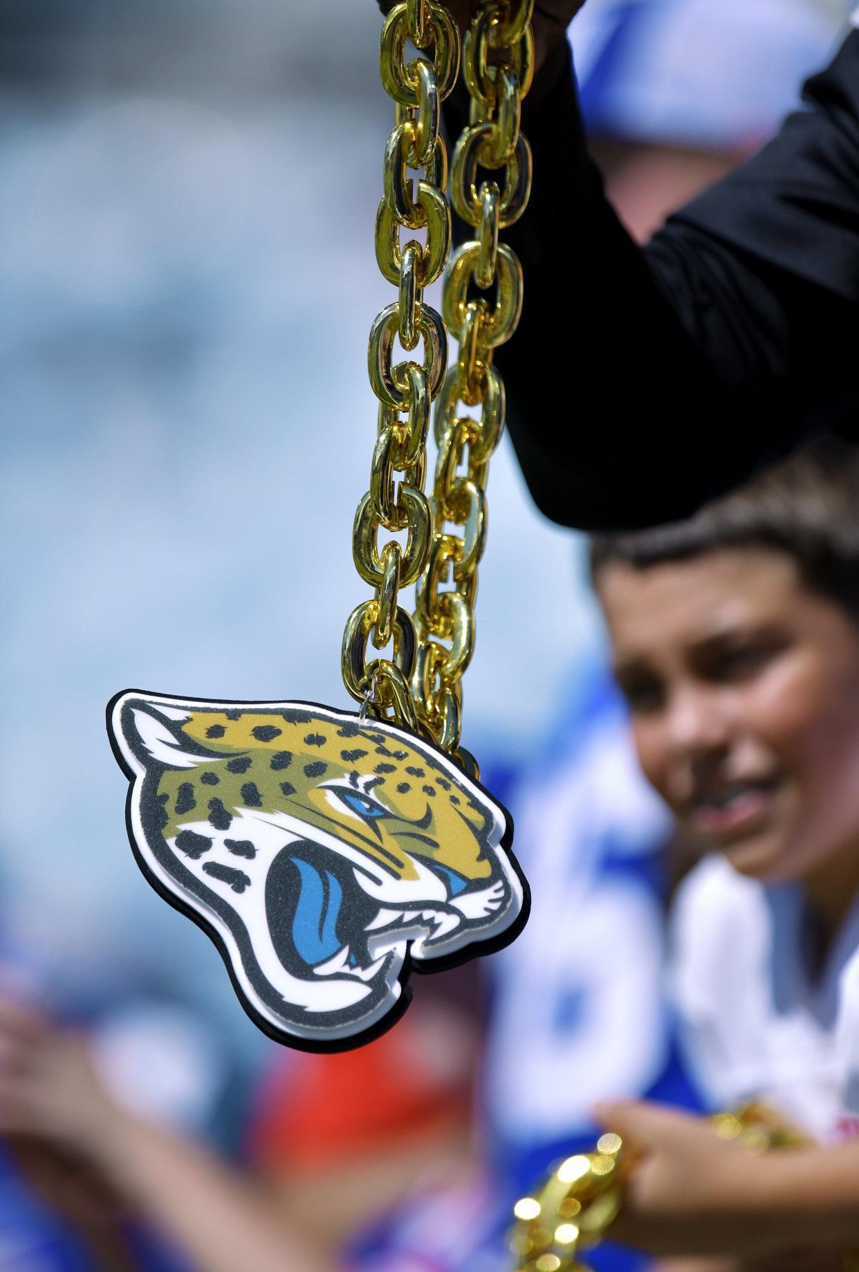 A Jaguars fans shows off his necklace during a game against the New York Giants on Oct. 23.