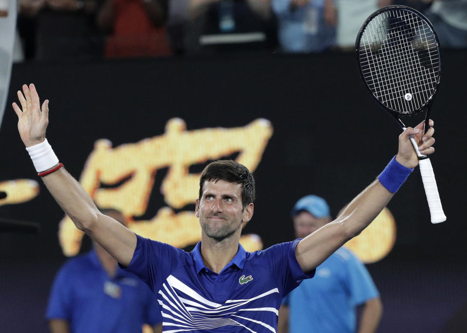 Serbia's Novak Djokovic celebrates after defeating United States' Mitchell Krueger in their first round match at the Australian Open tennis championships in Melbourne, Australia, Tuesday, Jan. 15, 2019. (AP Photo/Kin Cheung)