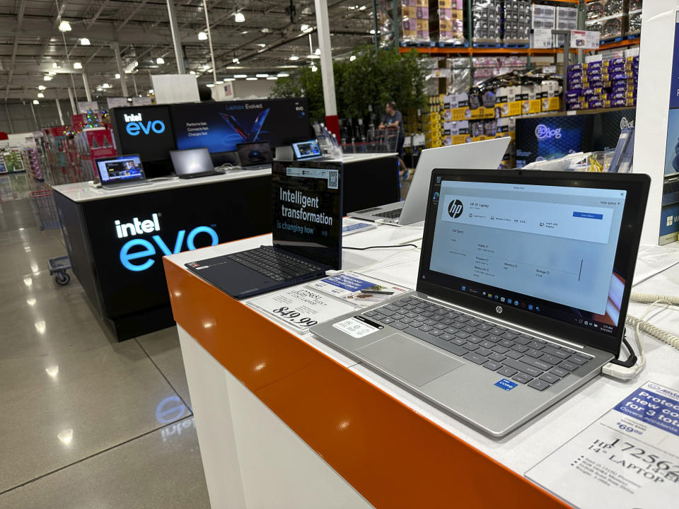Computer laptops sit on display in a Costco warehouse Wednesday, Sept. 13, 2023, in Sheridan, Colo. (AP Photo/David Zalubowski)