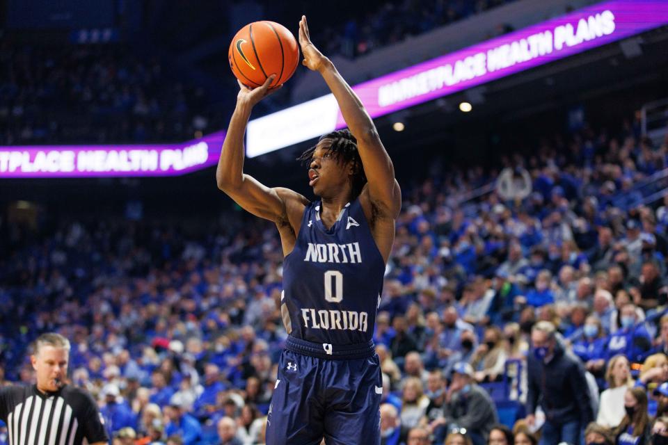 Emmanuel Adedoyin of the University of North Florida gets off a shot against Kentucky on Friday during their game at Rupp Arena in Lexington, Ky.