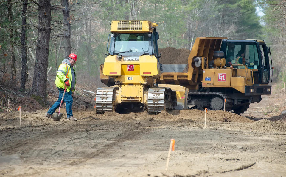 Eversources workers are shown in action on a transmission line construction project in Sudbury in March 2023. The utility is now proposing to replace a 1.3-mile stretch of underground electric lines between two substations, one in Hopkinton and the other in Milford.