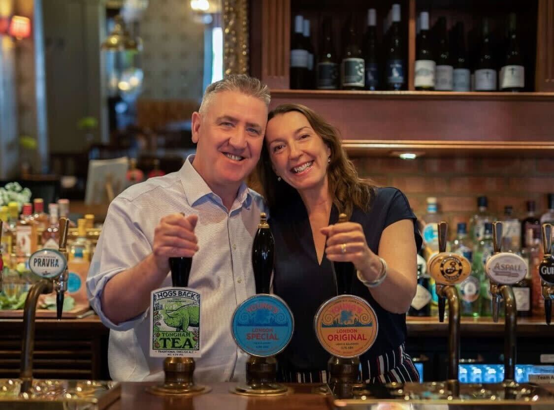 Mick and Sarah Dore, landlords of The Alexandra pub in Wimbledon, think it's important to make sure people aren't alone on Christmas. (The Alexandra/Instagram)