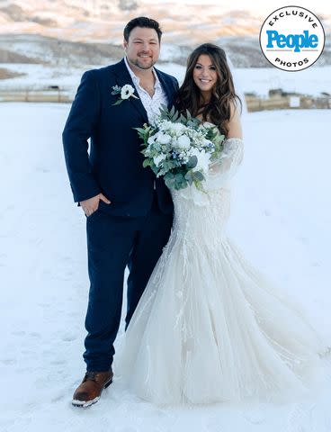 <p>markandjenna.pic-time.com</p> Ian Flanigan and wife Kelsey at their Colorado wedding