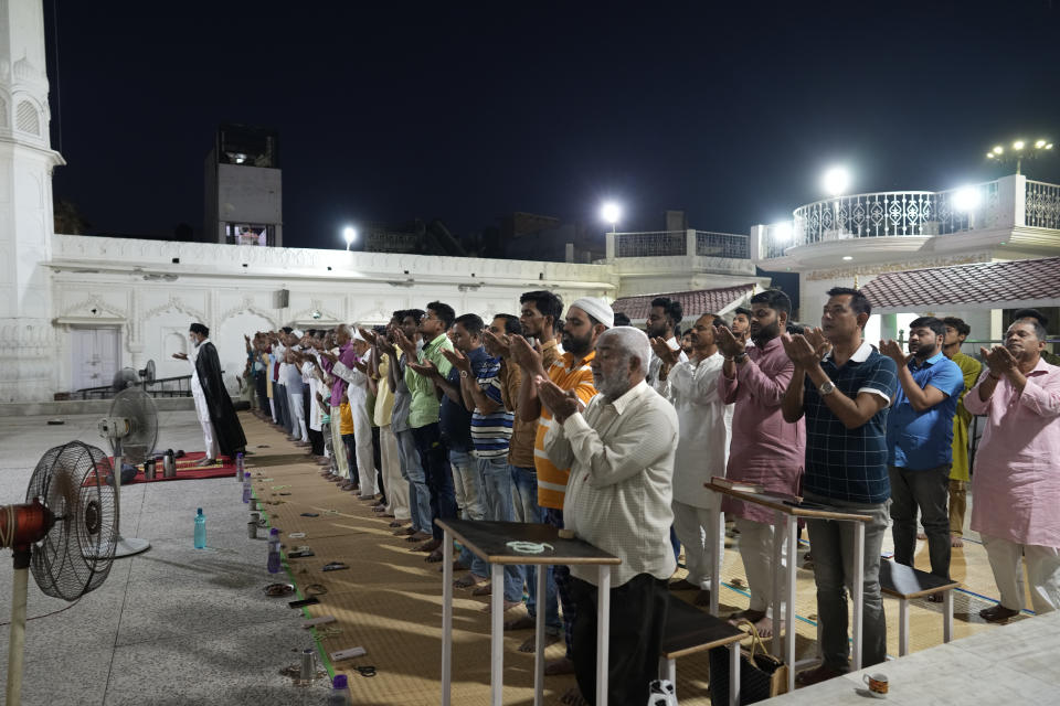 Muslims offer evening prayers before breaking their Ramadan fast at a Mosque, in Ayodhya, India, March 28, 2023. India is home to some two hundred million Muslims who make up the predominantly Hindu country's largest minority group. They are scattered across almost every part of India where a systematic anti-Muslim fury has swept since Prime Minister Narendra Modi first assumed power in 2014. (AP Photo/Manish Swarup)