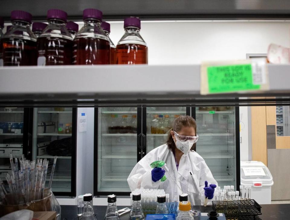 Microbiologist Blanca Escudero works in the sample preparation room at the Steve Troxler Agricultural Sciences Center on Thursday, April 14, 2022, in Raleigh, N.C.