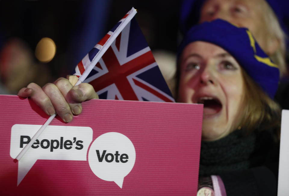 Anti-Brexit demonstrators gather in Parliament square in London, Tuesday, Jan. 15, 2019. Rival groups of pro-Brexit and pro-EU demonstrators are rallying outside Britain's Parliament ahead of Tuesday's historic vote on a divorce deal with the European Union. (AP Photo/Frank Augstein)