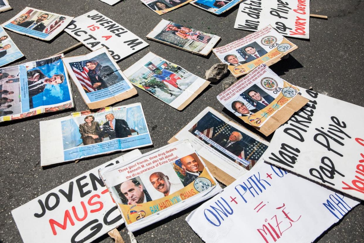 <span class="caption">Protest signs on the ground before a march on March 28, 2021, in Port-au-Prince, Haiti, to denounce President <span class="caas-xray-inline-tooltip"><span class="caas-xray-inline caas-xray-entity caas-xray-pill rapid-nonanchor-lt" data-entity-id="Jovenel_Moïse" data-ylk="cid:Jovenel_Moïse;pos:1;elmt:wiki;sec:pill-inline-entity;elm:pill-inline-text;itc:1;cat:Politician;" tabindex="0" aria-haspopup="dialog"><a href="https://search.yahoo.com/search?p=Jovenel%20Mo%C3%AFse" data-i13n="cid:Jovenel_Moïse;pos:1;elmt:wiki;sec:pill-inline-entity;elm:pill-inline-text;itc:1;cat:Politician;" tabindex="-1" data-ylk="slk:Jovenel Moïse;cid:Jovenel_Moïse;pos:1;elmt:wiki;sec:pill-inline-entity;elm:pill-inline-text;itc:1;cat:Politician;" class="link ">Jovenel Moïse</a></span></span>'s efforts to stay in office past his term.</span> <span class="attribution"><a class="link " href="https://www.gettyimages.com/detail/news-photo/signs-are-seen-on-the-ground-before-haitians-demonstrated-news-photo/1231992427?adppopup=true" rel="nofollow noopener" target="_blank" data-ylk="slk:Valerie Baeriswyl/AFP via Getty Images;elm:context_link;itc:0;sec:content-canvas">Valerie Baeriswyl/AFP via Getty Images</a></span>