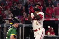 Los Angeles Angels' Luis Rengifo, right, gestures as he scores after hitting a solo home run as Oakland Athletics catcher Sean Murphy kneels at the plate during the first inning of a baseball game Thursday, Sept. 29, 2022, in Anaheim, Calif. (AP Photo/Mark J. Terrill)