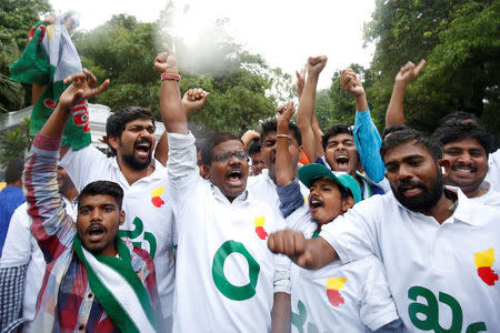 Supporters of Janata Dal (Secular) celebrate outside the governor's house in Bengaluru, India, May 15, 2018. REUTERS/Abhishek N. Chinnappa