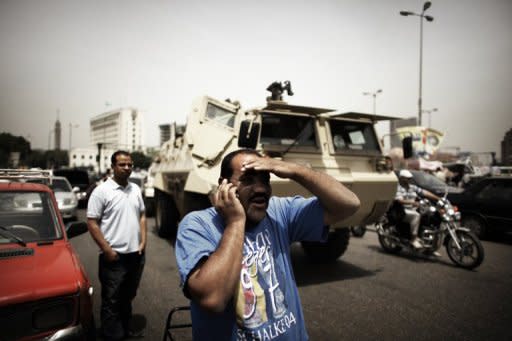 An Egyptian man talks on the telephone in front of an army vehicle in central Cairo's Tahrir Square in May 2012. For people living in countries where the the government monitors and censors the Internet, help is on the way