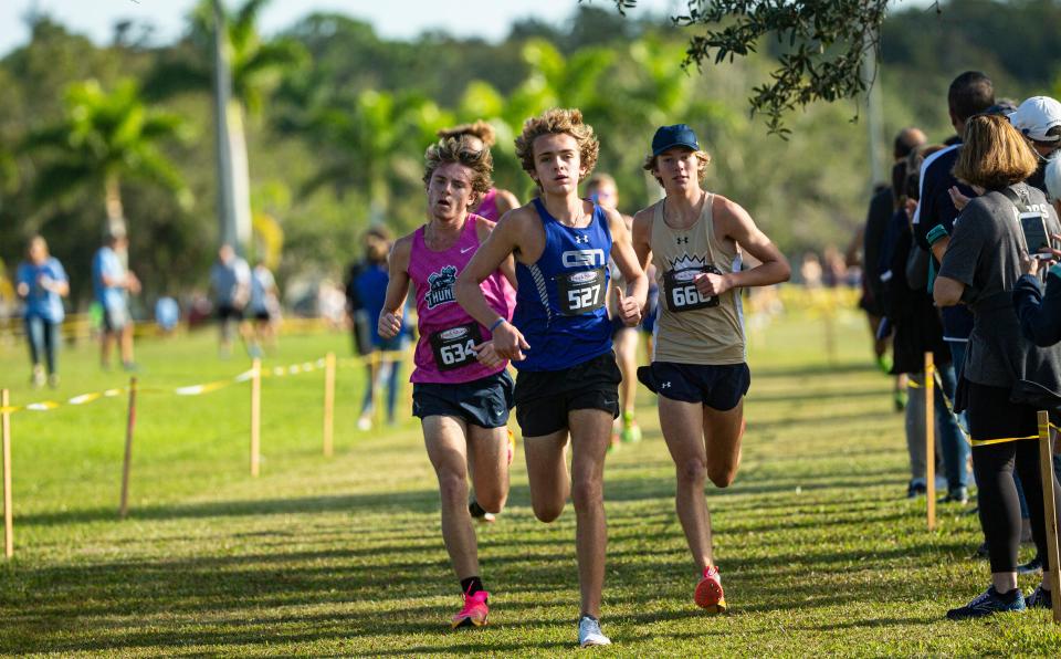 Tyler Mastrangelo from the Community School of Naples leads the FHSAA 1A District 6 Cross Country meet at Southwest Florida Christian Academy in Fort Myers on Thursday, Nov. 2, 2023. He won. Out of Door from Sarasota won as a team.