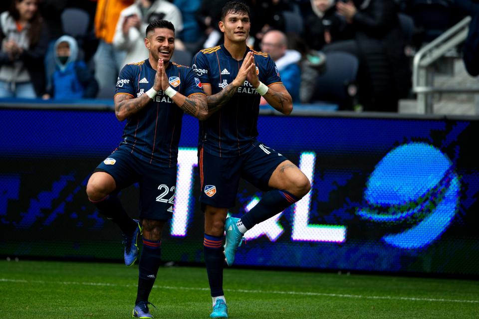 FC Cincinnati defender Ronald Matarrita (22) and FC Cincinnati forward Brandon Vázquez (19) celebrate after FC Cincinnati forward Brandon Vázquez (19) scored, Ronald Matarrita (22) scored FC Cincinnati first goal, in the first half of the MLS soccer match Saturday, March 19, 2022, at TQL Stadium in Cincinnati. 