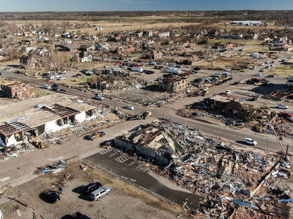 An aerial photo made with a drone shows widespread destruction of homes and businesses after tornadoes moved through the area leaving destruction and death across six states, in Mayfield, Kentucky, USA, 12 December 2021 (EPA)