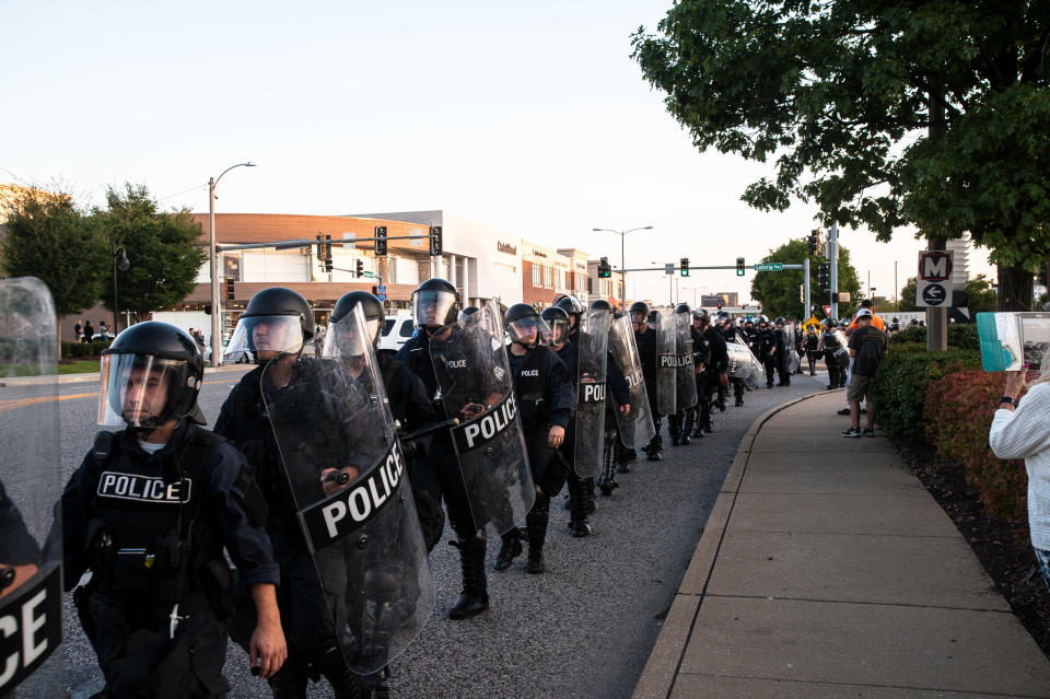 Riot police fall back and get on buses to leave once the protesters had&nbsp;dispersed. (Photo: Joseph Rushmore for HuffPost)