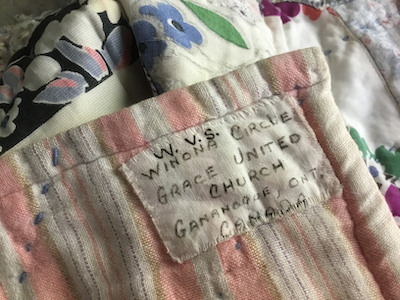 Detail of the hand-written label on the Winona Circle Quilt. Author provided