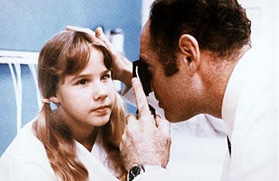 Poor, possessed Regan MacNeil (Linda Blair) gets examined in 1973's "The Exorcist." Warner Bros. photo