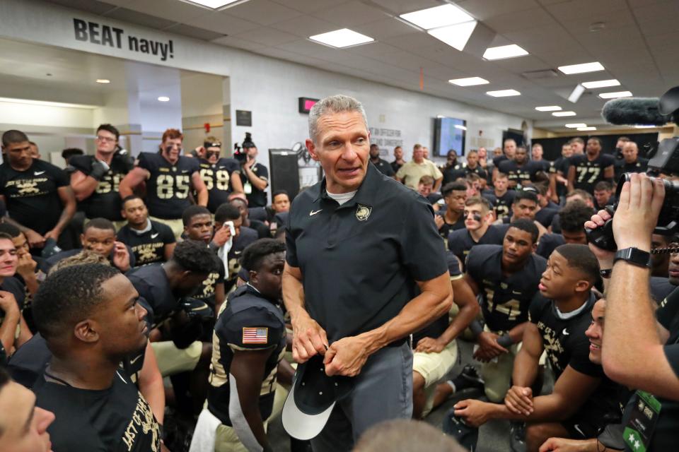 Army Black Knights head coach Jeff Monken speaks to his team in the locker room after the win against Western Kentucky.
