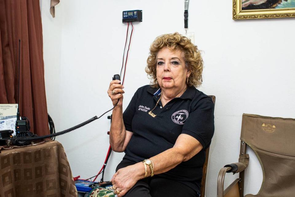 Zulma Dueño, a KP4 radio amateur, poses for a portrait at home on June 4, 2021, in Utuado, Puerto Rico. Dueño spent a week trapped inside her home after Hurricane Maria. After that, she became one of the registered radio aficionados in the group founded by Pedro Labayen.