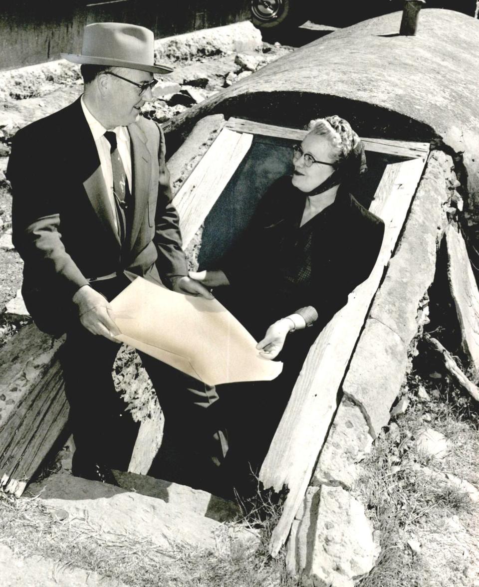 An old-fashioned "Aunt Kathy's 1889 Jam Cellar" would be in the middle of Frontier City. An actual cellar would be used to store the jams and jellies. Shown at the door of the cellar in April 1958 are Mr. and Mrs. R.A. Needler, who owned a frozen food company in Bethany.