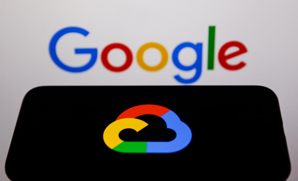 Google Cloud logo displayed on a phone screen and Google logo displayed on a screen in the background are seen in this illustration photo taken in Krakow, Poland on May 26, 2022. (Photo Illustration by Jakub Porzycki/NurPhoto via Getty Images)