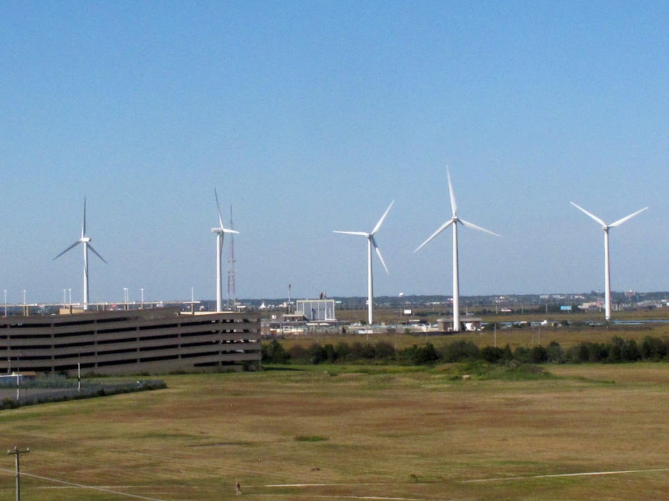 This Oct. 1, 2020 photo shows windmills at a utility plant in Atlantic City N.J. People who oppose the three offshore wind power projects approved off New Jersey's coast cite concerns about the environment and the economy, among others. (AP Photo/Wayne Parry)